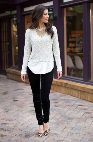 white lace sweater over tunic blouse and black velvet trousers