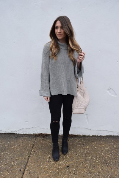 gray cabbage neck top with black super skinny jeans