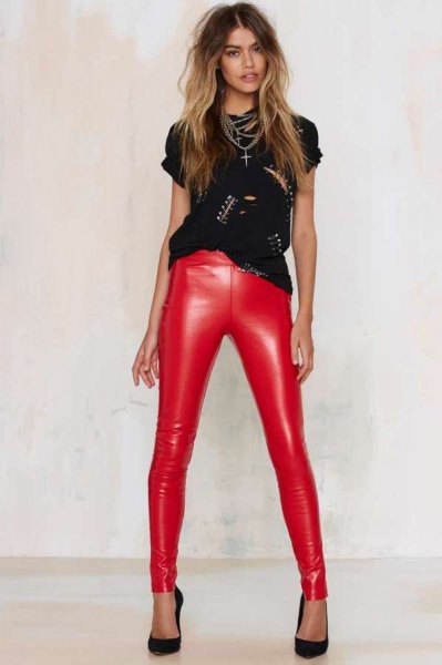 black nailed cut-out shirt with red skinny pants