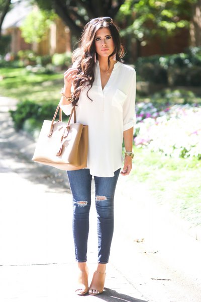 white v-neck summer tunic blouse with blue skinny ripped jeans