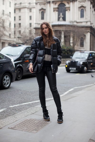 puffer jacket with wide striped sweater with leather pants