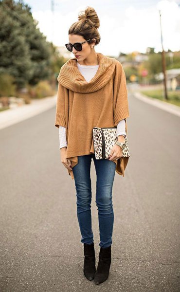 camel ribbed poncho sweater with sleeves and black pointed ankle boots