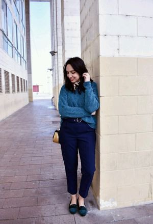 gray sweater with navy blue ankle pants