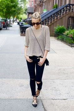 gray half-sweater with black ripped jeans and striped flats
