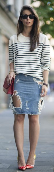 white and black striped sweater with crew neck with light blue mini ripped skirt