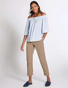 light blue from the shoulder blouse with beige slim fit cuffed chinos