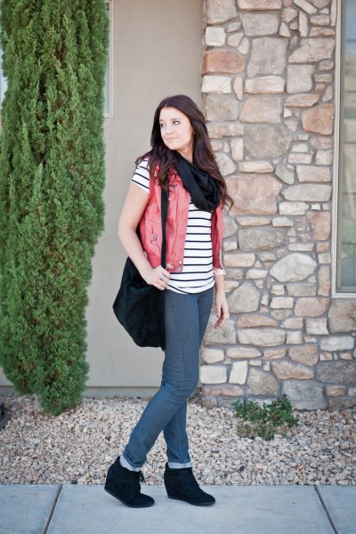 black and white striped short-sleeved t-shirt with beige vest and wedge boots