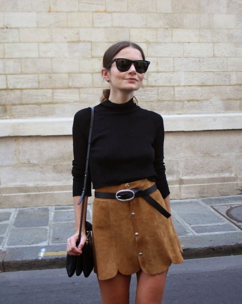 black sweater with brown peeled belt in mini skirt
