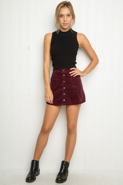 black mock neck halter neck top with mini suede button front skirt