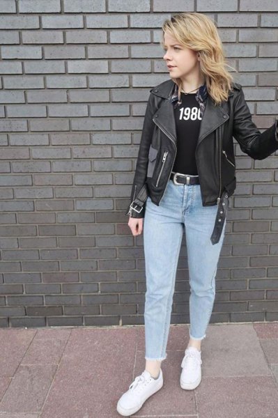 black leather jacket with printed tee and light blue mom jeans