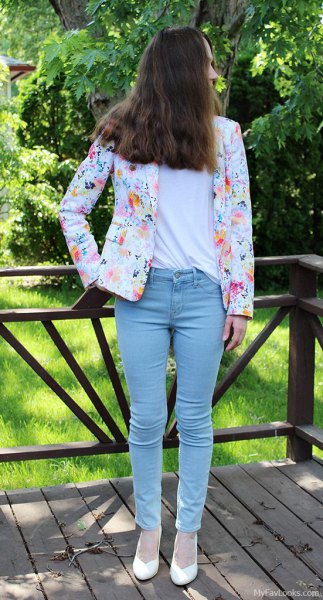 white floral printed blazer with light slim cut jeans