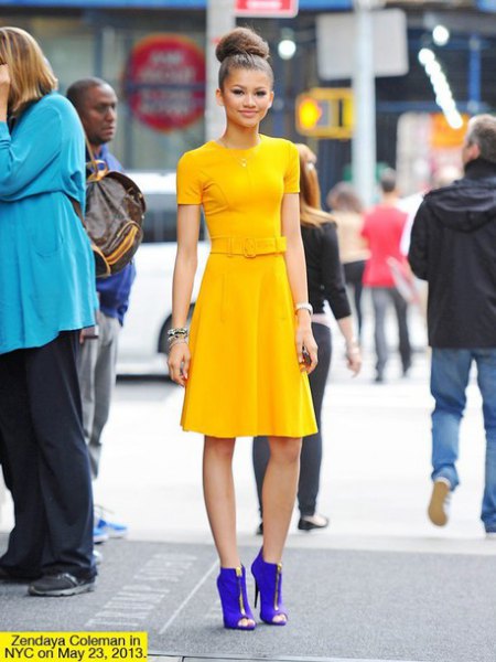 yellow fit and flare knee-length dress with royal blue ankle boots with open toe