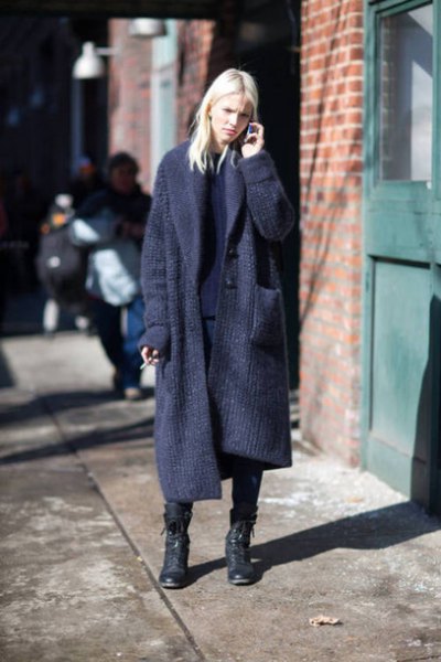 navy maxi ripped cardigan sweater with black combat shoes
