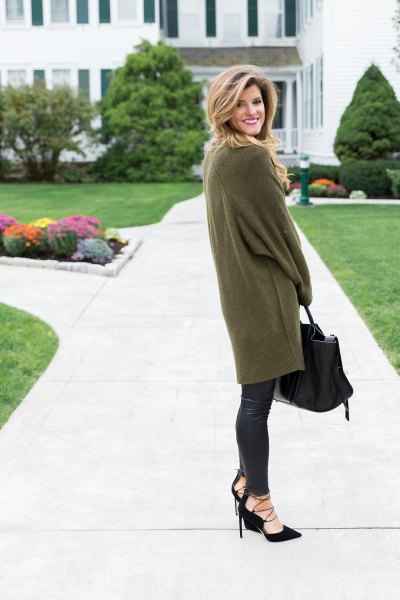 green long sleeve tunic sweater with black leather leggings
