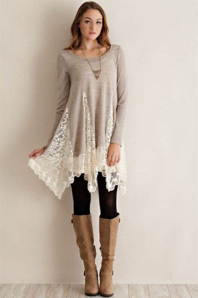 gray and white lace long tunic top with black leggings and knee high boots