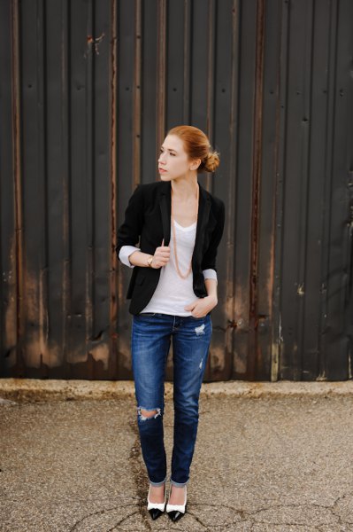black half-warm jacket with white top with shoe neck and blue jeans