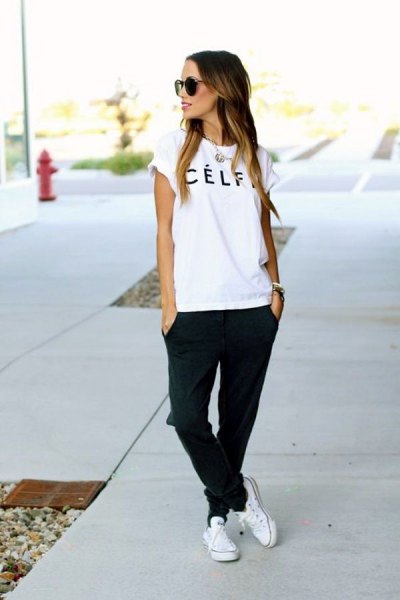 white logo tee with black jogging jeans and sneakers