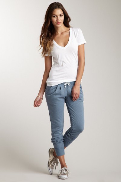 white deep v-neck shirt with gray joggers