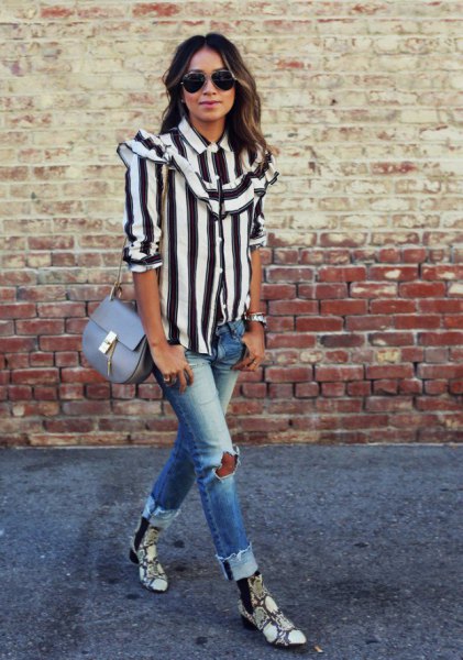 black and white striped button up shirt with ripped jeans