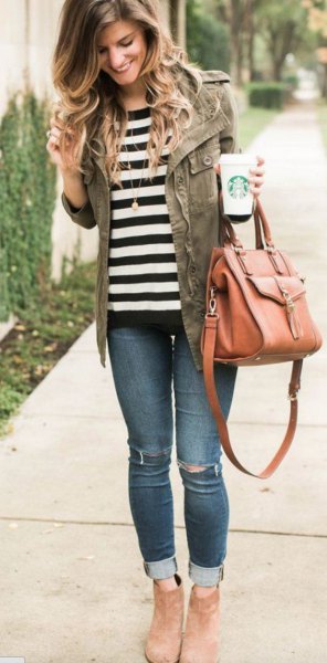 black and white striped t-shirt with military jacket and jeans