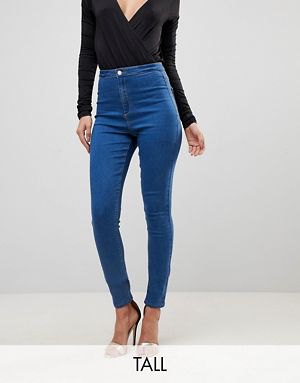 black deep v-neck long-sleeved top with blue high jeans