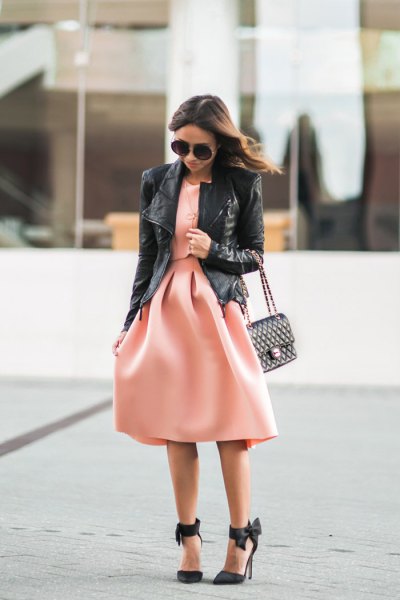 black leather jacket with blush pink fit and flare midi dress