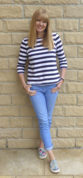 black and white striped tee with light blue cuffed jeans