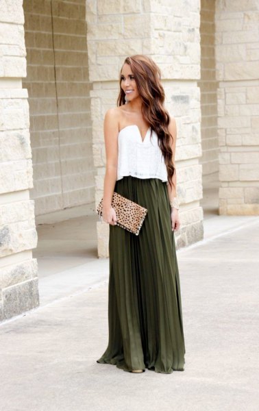 white sweetheart blouse with dark green pleated long skirt