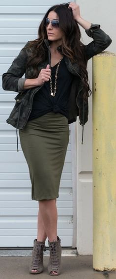 black camo jacket with olive green knee length skirt