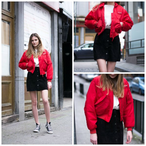red bomber jacket with black button front denim mini skirt