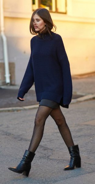 chunky knit sweater with gray mini skirt and ankle boots