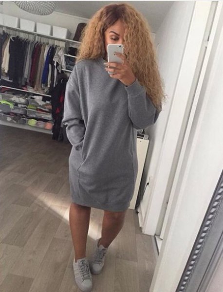 big sweater with gray sneakers