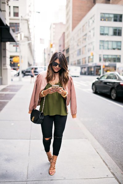 pink gold jacket with green vest top and black jeans