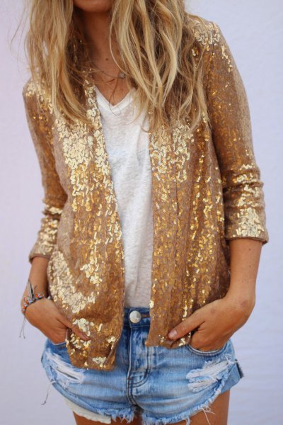 gold sequin jacket with blue mini-ripped denim shorts