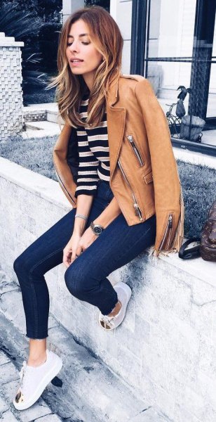 brown leather jacket with black and white wide striped sweater
