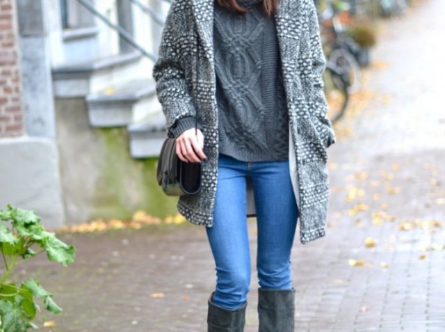 gray long sweater skirt with light blue jeans and black knee high boots