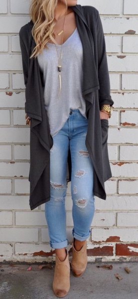 Low cut tee with dark gray sweater skirt and ripped jeans