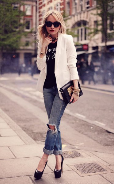 white blazer with black print tee and ripped jeans