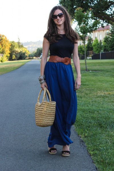 black t-shirt with brown belt and blue maxi skirt