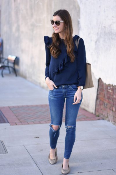 navy blue long sleeve top with blue ripped skinny jeans