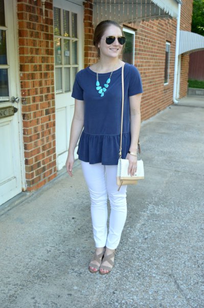 navy blue peplum short sleeve top with white jeans