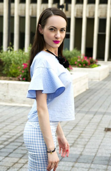 watch sleeve light blue blouse with plaid trousers