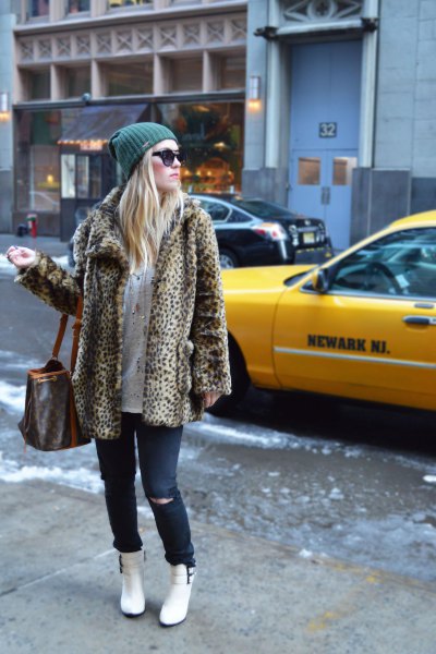 leopard print fleece jacket with jeans and white snow boots