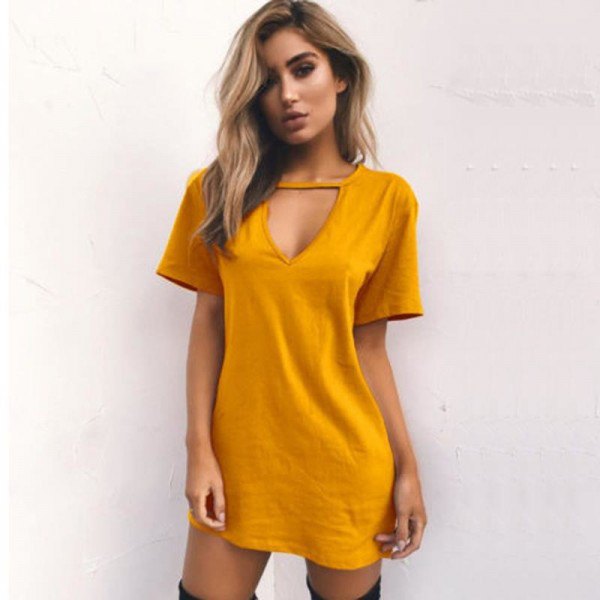 yellow cutout front t-shirt dress with high boots in the thigh