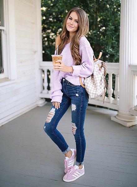 lavender one shoulder chunky ribbed sweater with blue jeans