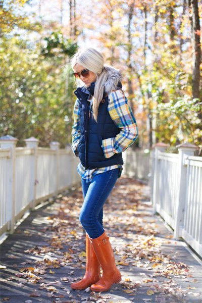 checkered shirt with puffer vest and orange leather with high knees