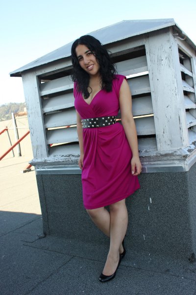 pink sleeveless knee-length dress with black double belt