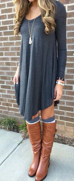 dark gray long-sleeved swing dress with brown leather shoes