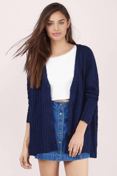 white cropped sweater with ribbed navy cardigan and denim skirt