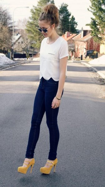 white peeled t-shirt with dark blue jeans and yellow heels